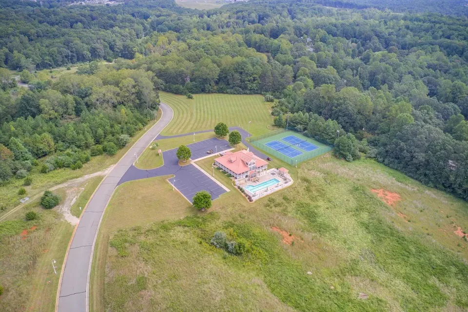 Aerial of the Bridgewater Bay clubhouse with its swimming pool and tennis court
