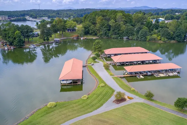 Aerial of the waterfront with covered boat slips and the community dock